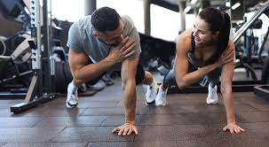 Toning Bingo Wings: Your Ultimate Guide to Sculpting Sleek Arms at the Gym 3 Fitness trainer demonstrating arm toning exercises West Drayton