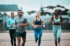 Sculpting Sleek Arms: The Essential Role of Cardio in Toning Without Bulking Up 3 image of people running to incorporate cardio West Drayton exercise into their life to help tone arms and body.